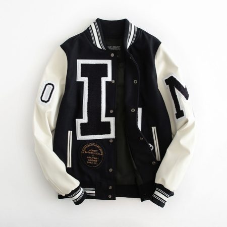 Men's letterman varsity jacket with large bold letter patches, black and white colorblock design, and front zipper closure