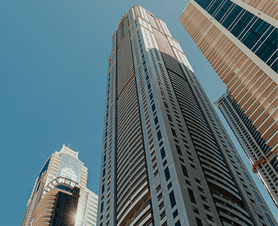 Simmerui contact us banner with modern city skyscrapers under blue sky