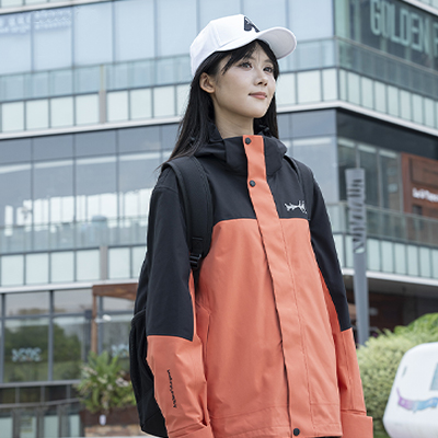 Simmerui woman wearing a stylish orange and black outdoor jacket, blending functionality and street fashion for everyday wear