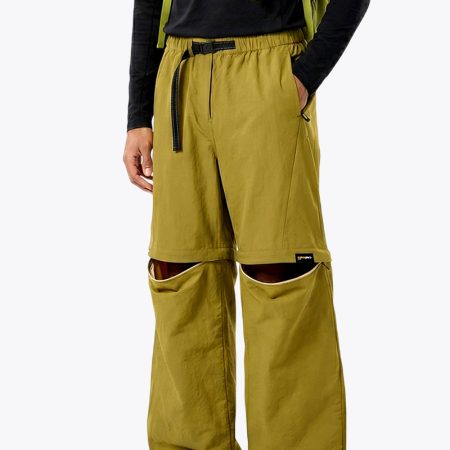 Model wearing convertible pants showing the zipped lower legs for versatility
