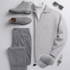 Gray monochrome outfit for men, including gray sweater, pants, shoes, and accessories like sunglasses and a cap, perfect for casual and chic looks.