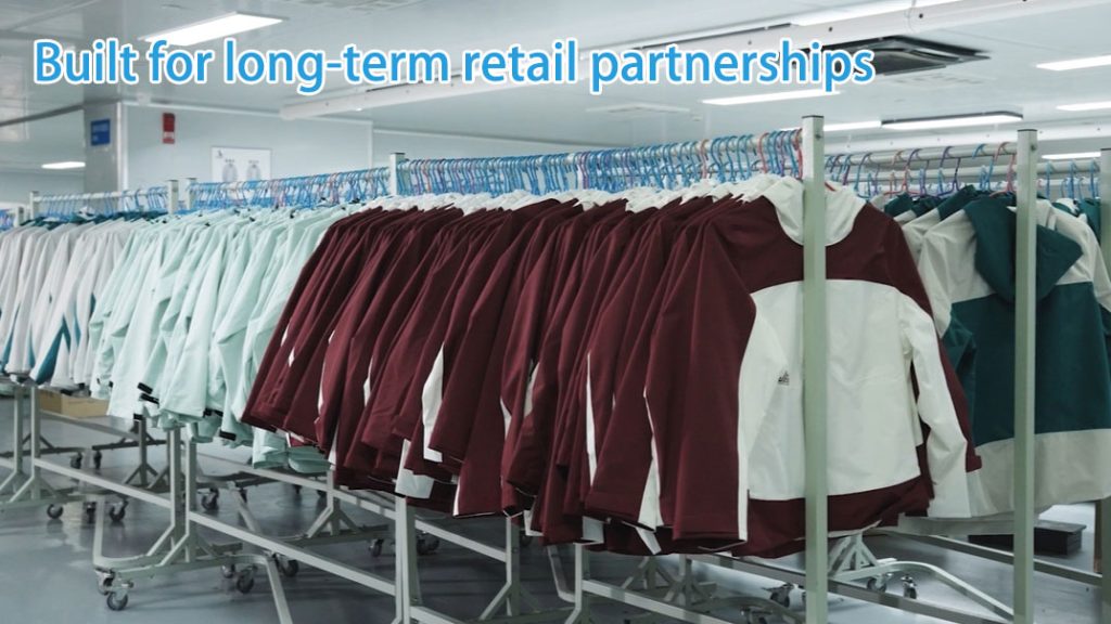 Outdoor apparel products hanging in a factory for retail distribution, built for long-term retail partnerships.