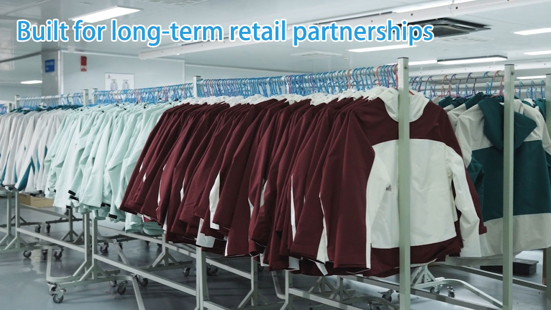 Outdoor apparel products hanging in a factory for retail distribution, built for long-term retail partnerships