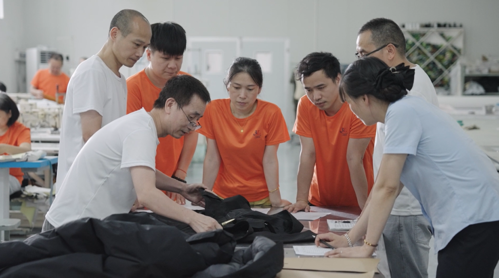 B2B outdoor apparel team involved in a partnership planning meeting, strategizing growth and retailer collaboration.