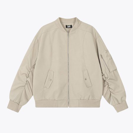Front view of apricot solid color pleated bomber jacket on a model.
