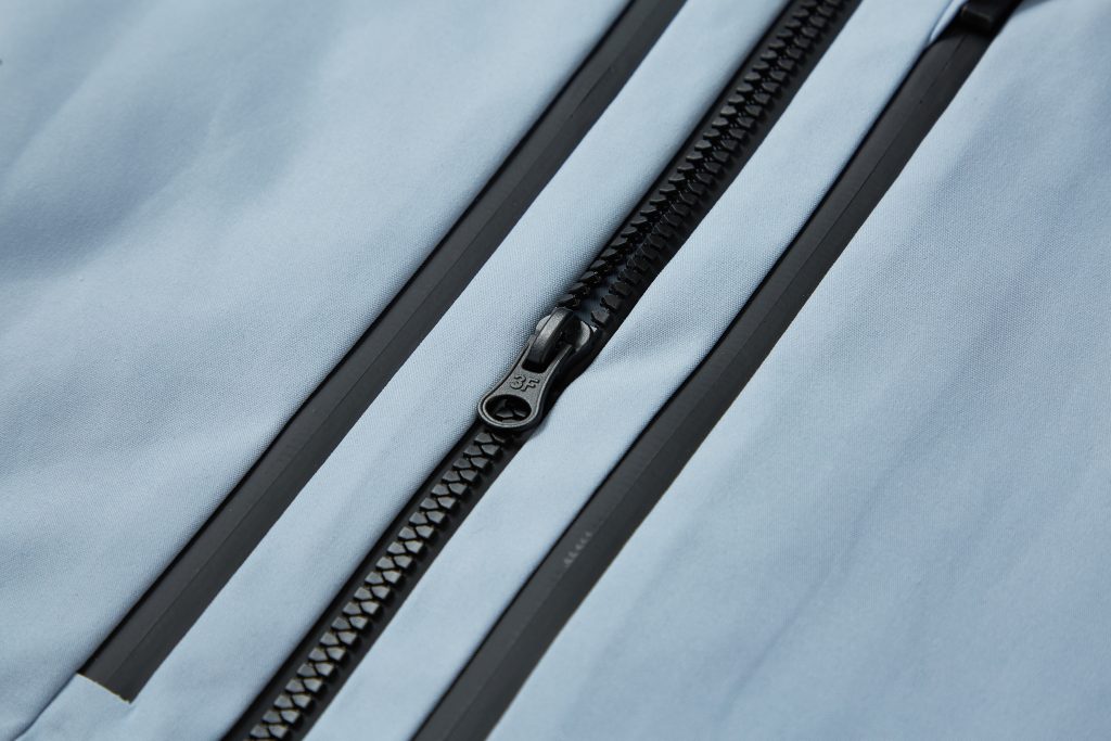 Close-up of durable waterproof outdoor jacket with reinforced seams and high-performance stitching
