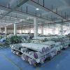 Factory view with rolls of textiles ready for bulk production and dyeing.