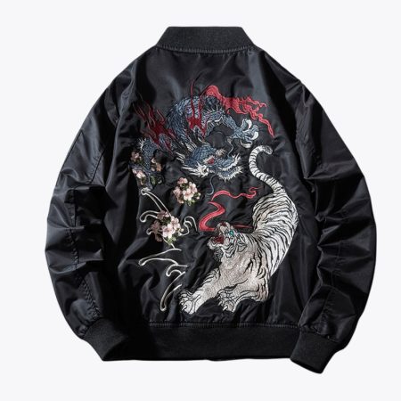 A back view of the black Simmerui bomber jacket, showcasing a large, intricate and colorful embroidered design featuring a blue dragon and a white tiger fighting, accented with delicate cherry blossom motifs.