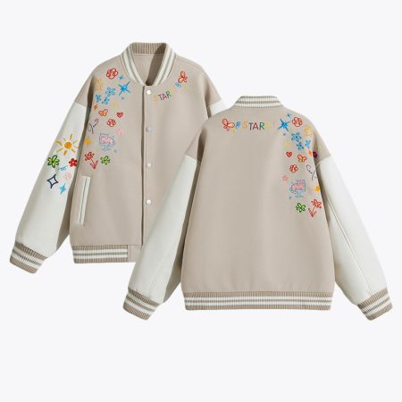 A comprehensive product view displaying both the front and back of the beige Simmerui embroidered baseball jacket, clearly showing the placement of the colorful whimsical embroidery, the contrast of the sleeves, and the overall varsity jacket silhouette.