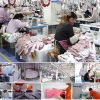 A view of a garment production line featuring numerous workers operating industrial sewing machines, highlighting the high-volume manufacturing process for technical outerwear.