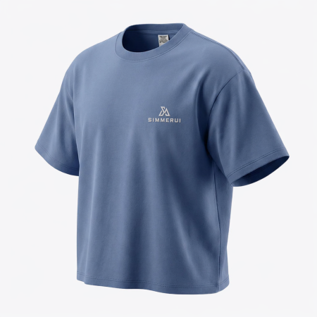 SimmerUI heavyweight blank boxy fit t-shirt in PARIS-TOWER-BLUE, featuring a clean minimalist design and relaxed short sleeves laid flat on a textured background.