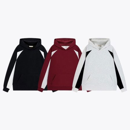 Three color options of the Simmerui heavyweight color blocked hooded sweatshirt displayed side by side, featuring black, burgundy, and light grey styles with contrasting sleeve panels.